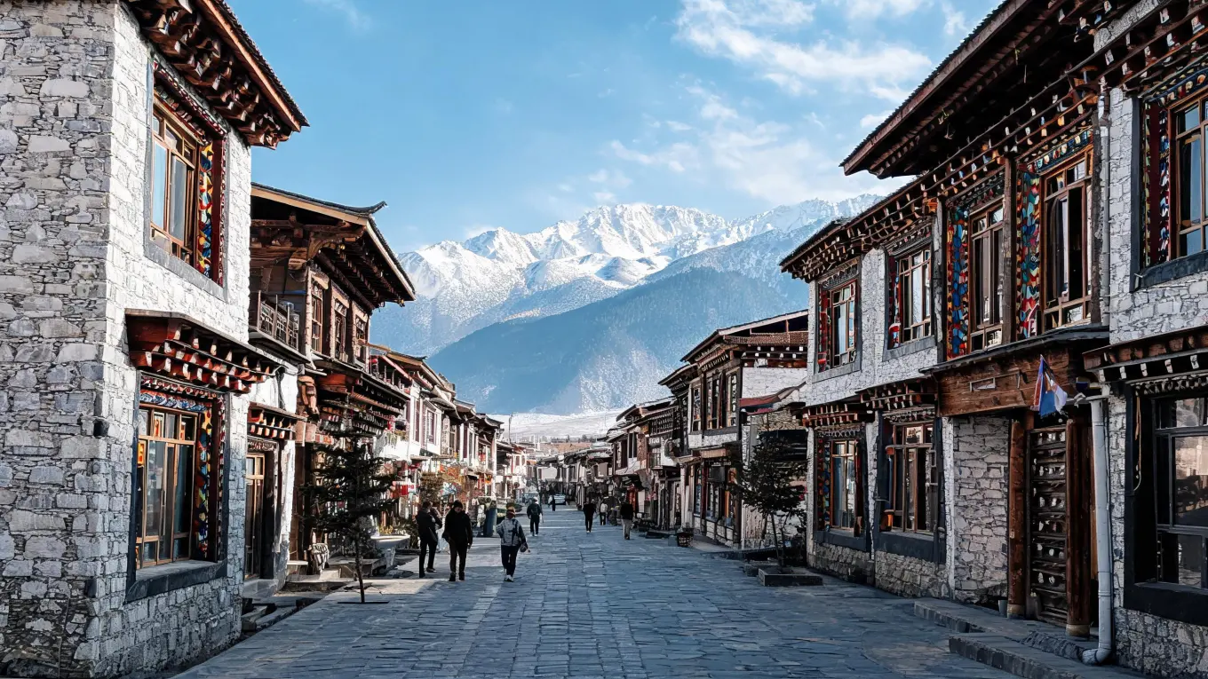 A street in a small town in the Tibetan Plateau of Western Sichuan, with traditional Tibetan houses and distant snow-capped mountains
